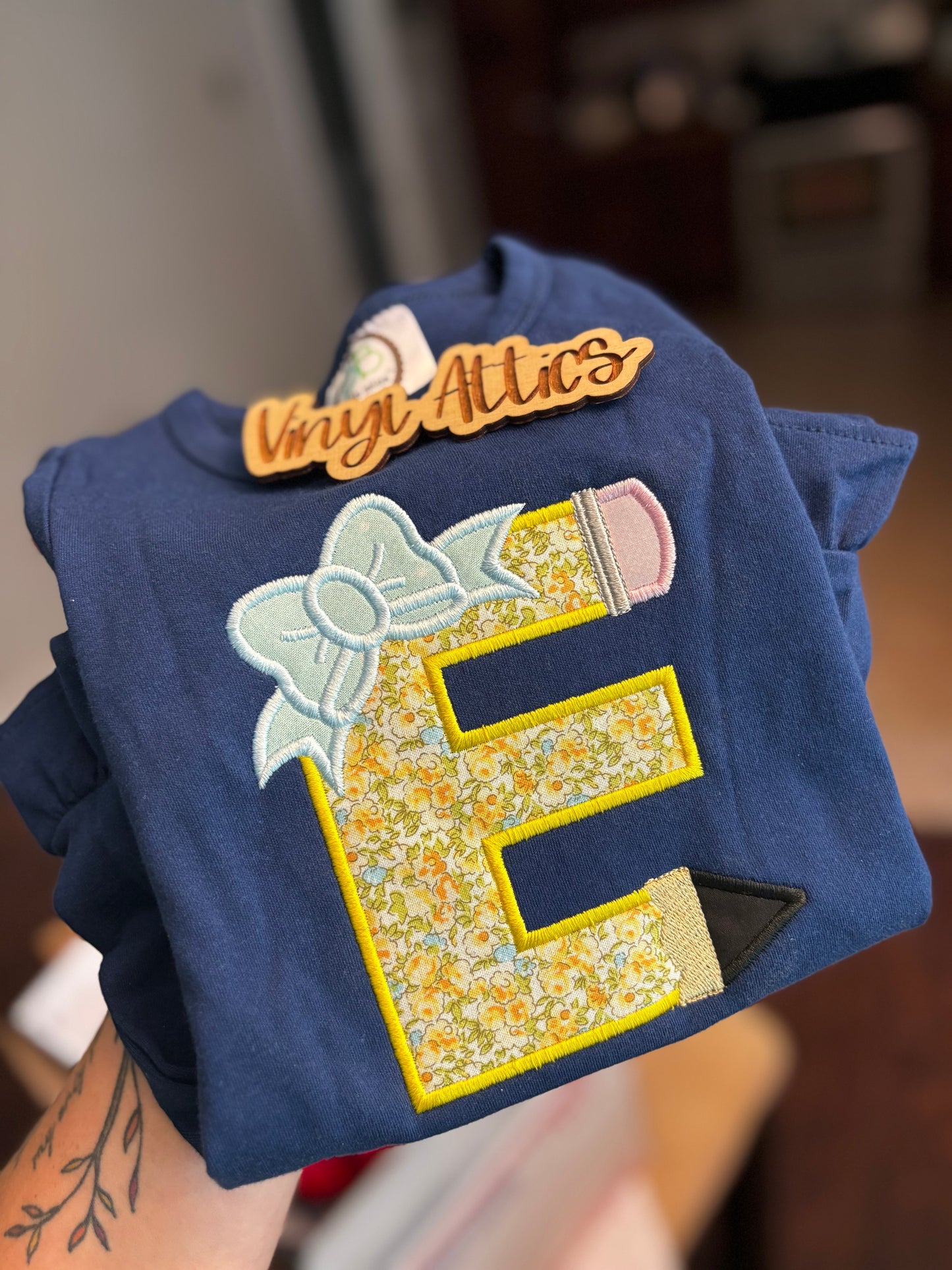 Pencil initial ruffle tee