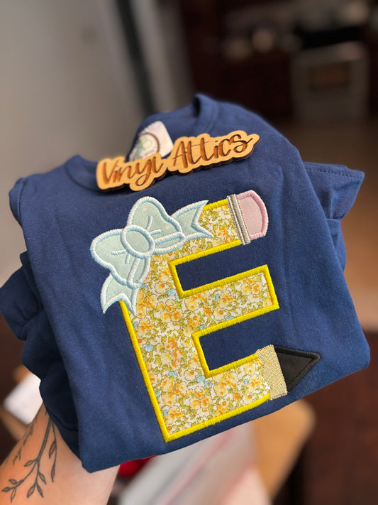 Pencil initial ruffle tee