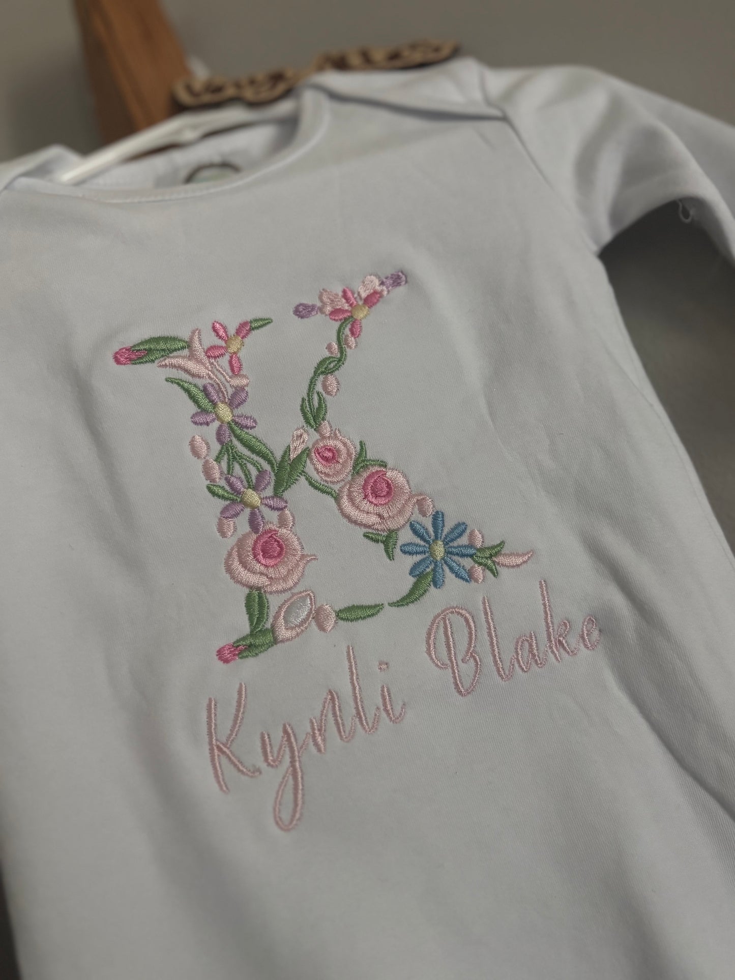 Floral initial embroidered baby gown